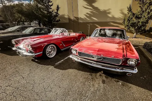old vehicles parked in a parking lot