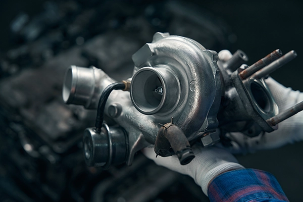 Technician holding turbocharger